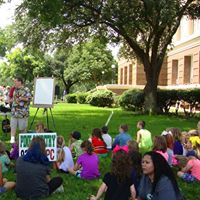Festival goers under the trees on our beautiful courthouse lawn.